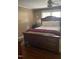 Bedroom featuring a spacious bed, nightstand, and bright window at 40 Bait Rd, Dunn, NC 28334