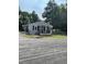 Quaint single-story home featuring a welcoming front porch and tidy landscaping at 40 Bait Rd, Dunn, NC 28334
