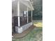 Inviting front porch with white lattice trim and brown railing at 40 Bait Rd, Dunn, NC 28334