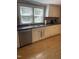 Functional kitchen featuring a stainless steel sink and white cabinetry at 40 Bait Rd, Dunn, NC 28334