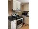 Kitchen featuring stainless steel appliances and neutral-toned cabinetry at 40 Bait Rd, Dunn, NC 28334