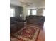 Bright living room with comfortable seating, a ceiling fan, and a decorative rug at 40 Bait Rd, Dunn, NC 28334