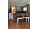 Cozy living room featuring laminate flooring and a view into the kitchen at 40 Bait Rd, Dunn, NC 28334