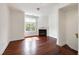 Bright living room featuring a fireplace, large windows, and hardwood floors at 400 W Rosemary St # 114, Chapel Hill, NC 27516