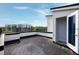 Exterior shot showing an open door on a roof deck with a scenic view of the cityscape at 400 W Rosemary St # 114, Chapel Hill, NC 27516