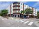 Brick building at 300 West Rosemary with street access, crosswalk, trees, and blue skies at 400 W Rosemary St # 114, Chapel Hill, NC 27516