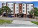 Street view of white and red brick building with trees and street-level access at 400 W Rosemary St # 114, Chapel Hill, NC 27516