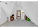 Finished attic space with vaulted ceilings, neutral carpet, and ample storage solutions at 407 Hillcrest Ave, Burlington, NC 27215