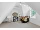 Finished attic space with multiple windows for natural light and unique architectural details at 407 Hillcrest Ave, Burlington, NC 27215