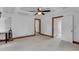 Finished attic has painted trim, carpet, ceiling fan, and multiple entrances offering versatile options at 407 Hillcrest Ave, Burlington, NC 27215