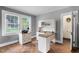 Bright home office with built-in desk, parquet floors, and plenty of natural light from the large double window at 407 Hillcrest Ave, Burlington, NC 27215