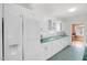 Spacious kitchen with large refrigerator, green countertops, and white cabinets at 407 Hillcrest Ave, Burlington, NC 27215