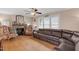 Comfortable living room with a stone fireplace, sofa, and natural light from the window at 407 Hillcrest Ave, Burlington, NC 27215