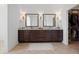 Bathroom includes a double vanity with granite countertops and decorative lighting at 4729 Adler Pass, Raleigh, NC 27612