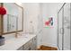 Bathroom features a marble countertop vanity, gold fixtures, and glass-enclosed shower at 4729 Adler Pass, Raleigh, NC 27612