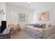 Bedroom includes neutral walls, a cozy daybed, and natural light at 4729 Adler Pass, Raleigh, NC 27612