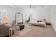 Primary bedroom with natural light, seating, and a ceiling fan at 4729 Adler Pass, Raleigh, NC 27612