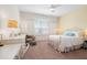 Inviting bedroom with a ceiling fan and a charming decorative scheme at 4729 Adler Pass, Raleigh, NC 27612