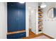 Mudroom boasts custom blue cabinets, open shelving, and a wood bench at 4729 Adler Pass, Raleigh, NC 27612