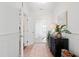 Hallway features a dresser, light-colored rug, and seamless doorway transitions at 4729 Adler Pass, Raleigh, NC 27612