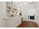 Bright home office offers custom built-ins and a modern desk at 4729 Adler Pass, Raleigh, NC 27612