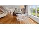 An open kitchen with stainless appliances and a dining area is perfect for entertaining or enjoying Gathering meals at 4729 Adler Pass, Raleigh, NC 27612