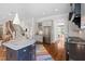 A gourmet kitchen features a large center island with seating and stainless appliances and ample natural light at 4729 Adler Pass, Raleigh, NC 27612