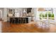 This open kitchen features a large island with seating and a breakfast nook that gets tons of natural light at 4729 Adler Pass, Raleigh, NC 27612