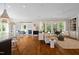 This open-concept living area flows from kitchen to the fireplace, with large windows and natural light at 4729 Adler Pass, Raleigh, NC 27612
