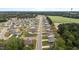 An aerial view reveals a meticulously planned community with neat rows of homes and lush greenery, offering a serene lifestyle at 5081 Pioneer Dr, Sanford, NC 27330