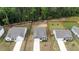 Aerial view of a neighborhood showcases well-maintained lawns and tree-lined streets creating a peaceful suburban setting at 5081 Pioneer Dr, Sanford, NC 27330