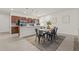 Dining area near kitchen featuring a wooden table with seating for six, with a kitchen bar at 5081 Pioneer Dr, Sanford, NC 27330