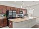 Modern kitchen with granite countertops, stainless steel appliances, and stylish lighting at 5081 Pioneer Dr, Sanford, NC 27330