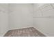 Empty walk-in closet with wire shelving and neutral carpet at 5081 Pioneer Dr, Sanford, NC 27330