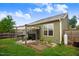 A covered patio leads to a well-maintained, fenced backyard with green grass providing a serene outdoor living space at 51 Balboa Pkwy, Clayton, NC 27520