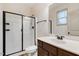 Bathroom featuring a glass shower door, modern vanity, and a large mirror at 51 Balboa Pkwy, Clayton, NC 27520