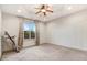 Spacious bedroom with carpet flooring, large window, a tray ceiling, and ceiling fan at 51 Balboa Pkwy, Clayton, NC 27520