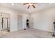 Large bedroom with carpet, ceiling fan, and easy access to an en suite bathroom with glass shower at 51 Balboa Pkwy, Clayton, NC 27520