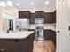 Bright kitchen with modern appliances, dark wood cabinets and granite countertops at 51 Balboa Pkwy, Clayton, NC 27520