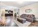 Spacious living room with hardwood floors and modern decor open to kitchen at 51 Balboa Pkwy, Clayton, NC 27520