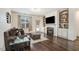 Comfortable living area showcasing a fireplace and built-in shelving for storage at 51 Balboa Pkwy, Clayton, NC 27520