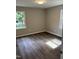 Recently updated bedroom with new flooring and paint, and two windows that allow for natural light at 510 North St, Graham, NC 27253