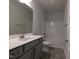 Bathroom with modern vanity, shower-tub combination, and gray tile flooring at 511 Sweet Potato Lane # 10, Nashville, NC 27856
