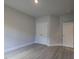 Comfortable bedroom with neutral walls, wood-look flooring, and ample closet space at 511 Sweet Potato Lane # 10, Nashville, NC 27856