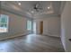 Spacious bedroom with tray ceiling, fan, and large windows offering bright natural light at 511 Sweet Potato Lane # 10, Nashville, NC 27856