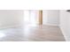 Bright bedroom showcasing luxury vinyl plank flooring, neutral paint and a sunny window at 511 Sweet Potato Lane # 10, Nashville, NC 27856