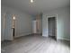 Spacious bedroom with light gray walls and wood-look flooring, bright and inviting at 511 Sweet Potato Lane # 10, Nashville, NC 27856