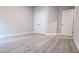Neutral bedroom featuring luxury vinyl plank floors, and a closet with double doors at 511 Sweet Potato Lane # 10, Nashville, NC 27856