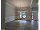 Elegant dining room with hardwood floors, wainscoting, and a chandelier at 511 Sweet Potato Lane # 10, Nashville, NC 27856