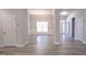 Open floorplan with a dining area featuring wainscoting and luxury vinyl plank floors at 511 Sweet Potato Lane # 10, Nashville, NC 27856